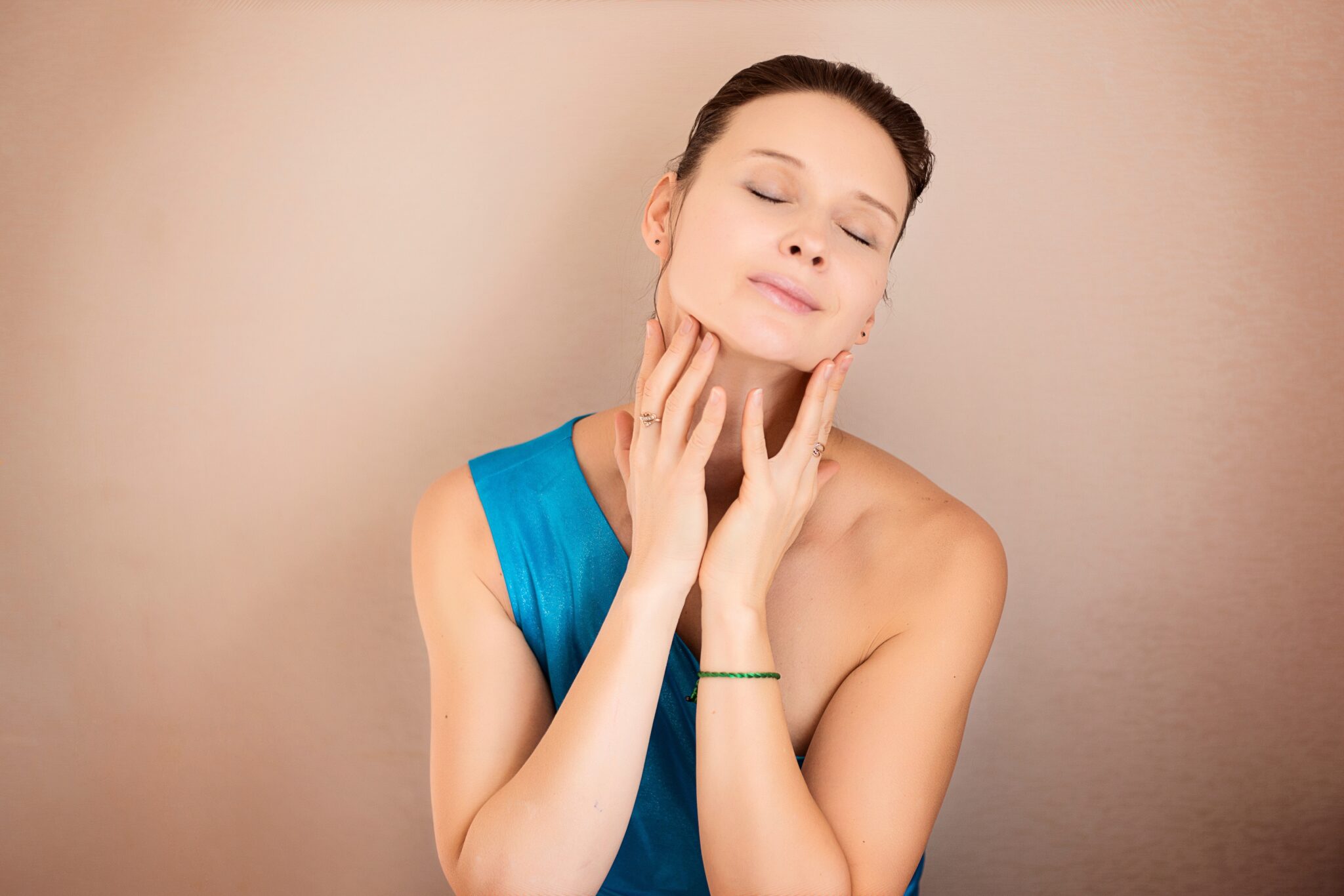 Woman enjoying touching her face.